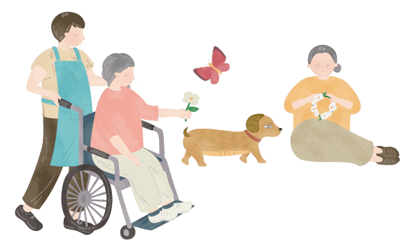 車椅子に乗っている、花の冠を作っている人たち